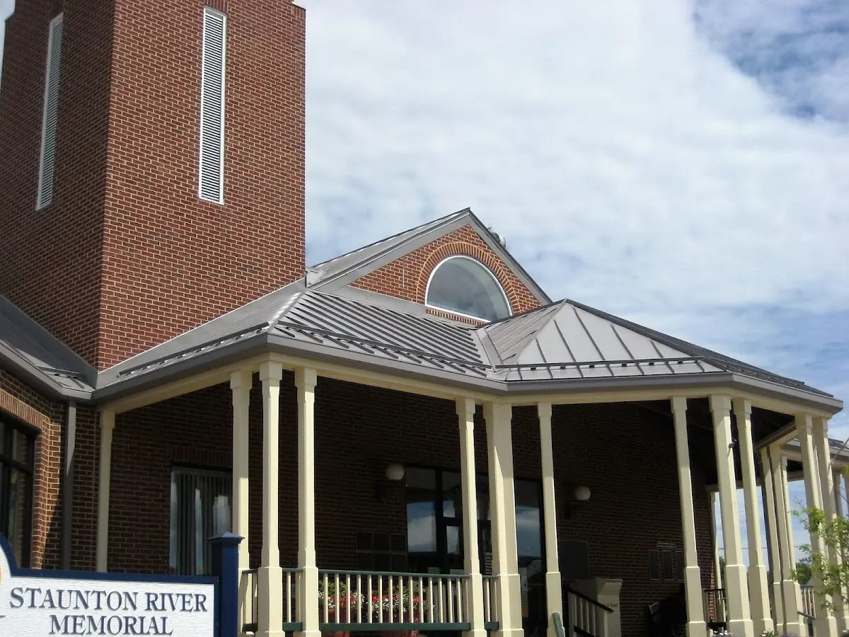 Skilled roofing craftsmen working on a residential roof in Fort Dodge